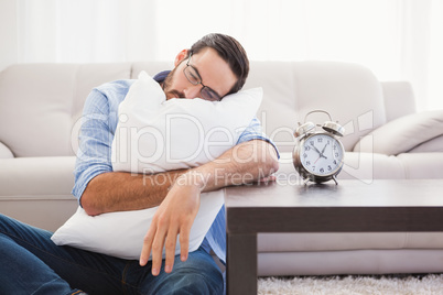 Exhausted man sleeping with head resting on pillow