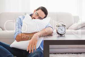 Exhausted man sleeping with head resting on pillow
