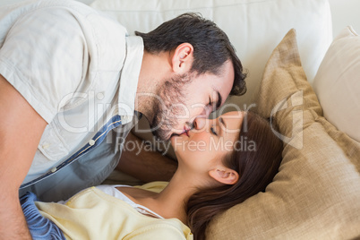 Cute couple kissing on couch