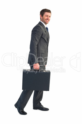 Businessman walking with his briefcase