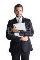 Businessman in suit posing with his laptop