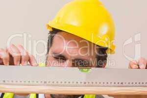 Construction worker using spirit level