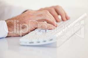 Businessman hands typing on keyboard