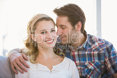 Loving couple sitting on couch