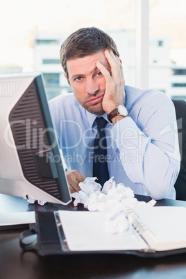 Bored businessman at his desk