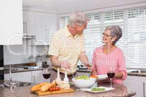 Senior couple preparing lunch together