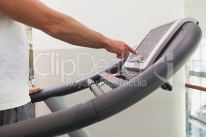 Fit man working out on treadmill