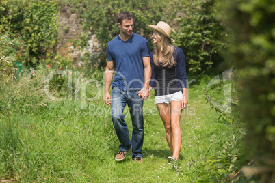 Cute couple walking holding hands