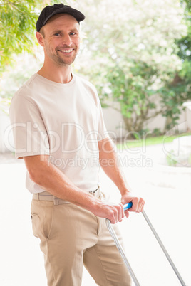 Happy delivery man pushing trolley Happy delivery man pushing trolley