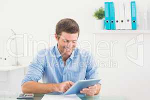 Casual businessman using tablet