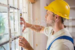 Construction worker using spirit level