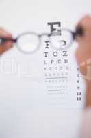 Reading glasses looking at eye test