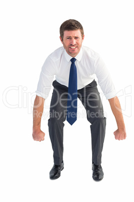 Businessman bending and lifting