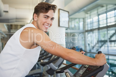 Fit man working out on the exercise bike