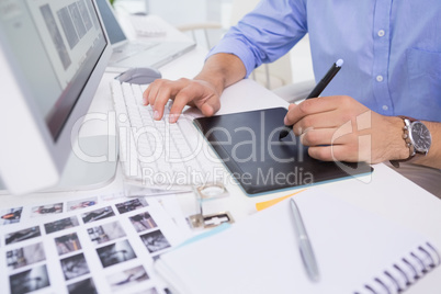 Graphic designer using digitizer at his desk