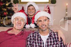 Son joking to his father and grandfather