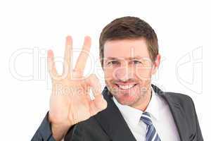 Businessman smiling and making ok sign