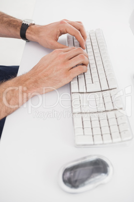 Businessman typing on computer keyboard