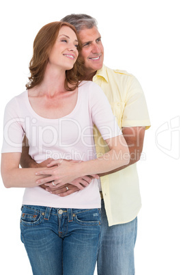 Casual couple hugging and smiling Casual couple hugging and smiling
