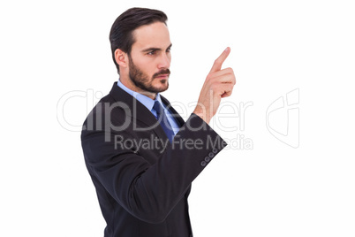 Focused businessman pointing in suit jacket