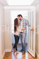 Cute couple walking through the door