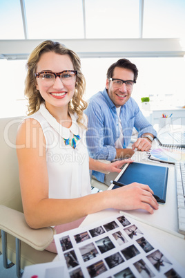 Photo editors working together on graphics tablet