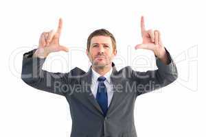 Focused businessman pointing with fingers