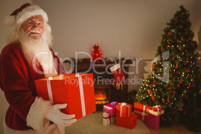 Happy santa delivering presents at christmas eve