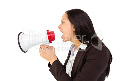 Pretty businesswoman shouting with megaphone