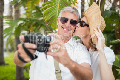 Holidaying couple taking a selfie