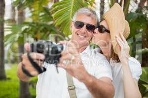 Holidaying couple taking a selfie