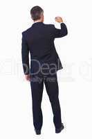 Rear view of a businessman drawing with a chalk