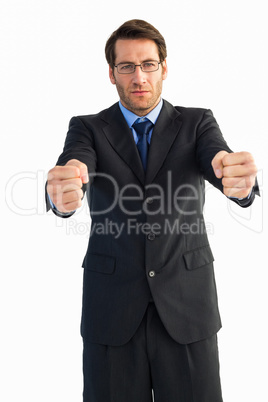 Businessman standing with clenched fists