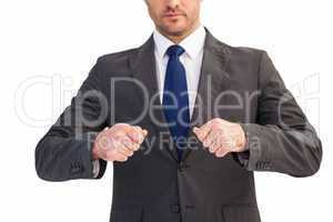 Mid section of a businessman with clenched fist