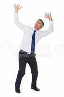 Businessman looking up with arms up