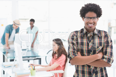 Young creative man smiling at camera