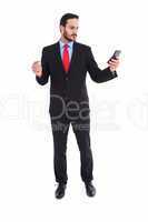 Handsome businessman texting on phone