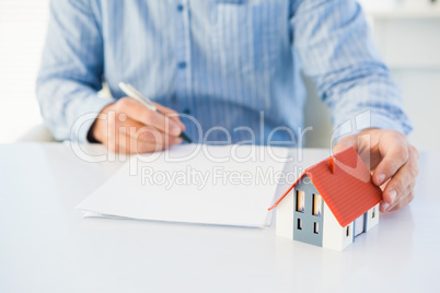 Man drawing the model house