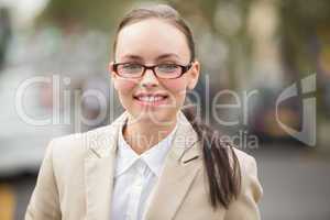 Young businesswoman looking at camera