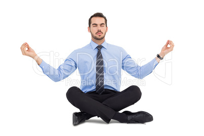 Calm businessman sitting in lotus pose