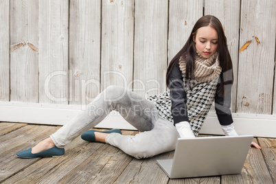 Pretty hipster using her laptop