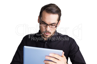 Cheerful businessman in glasses using tablet