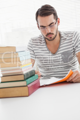 Casual businessman studying at his desk