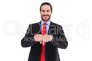 Smiling businessman with clenched fist in front of him