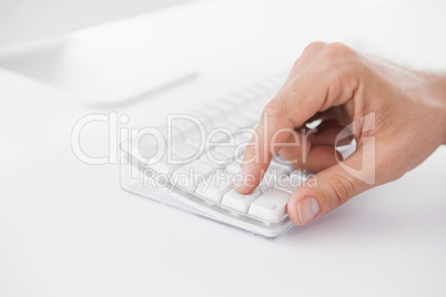 Businessman pushing key on keyboard