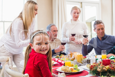 Portrait of a pretty little girl in a christmas dinner