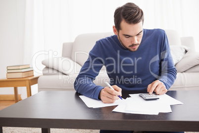 Young man paying his bills