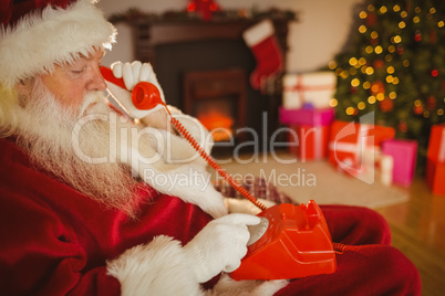 Santa claus making a phone call