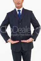 Mid section of a businessman in suit with hands out