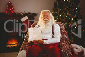 Santa claus showing his book